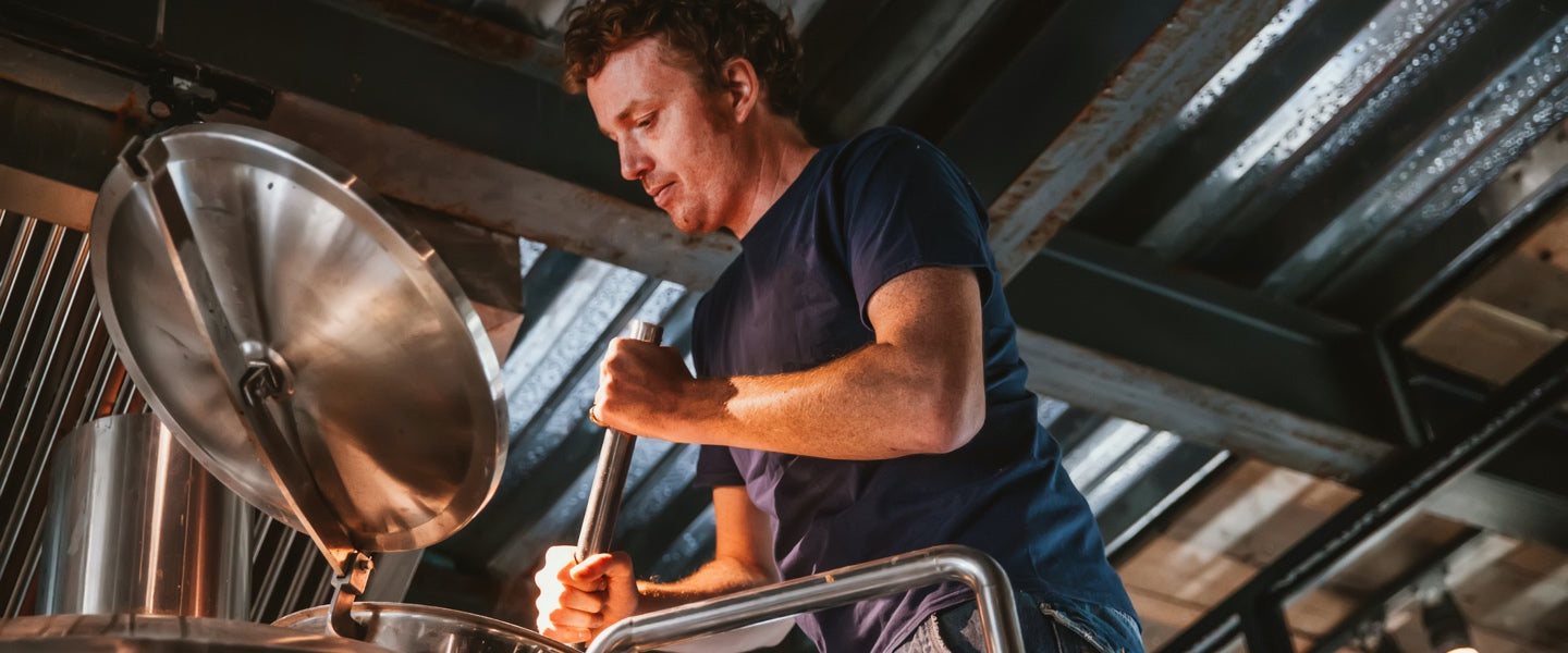 A brewer using English Hops or British Hops or UK Hops to make a craft beer